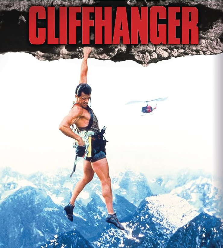 Sylvester Stallone hangs from a cliff
