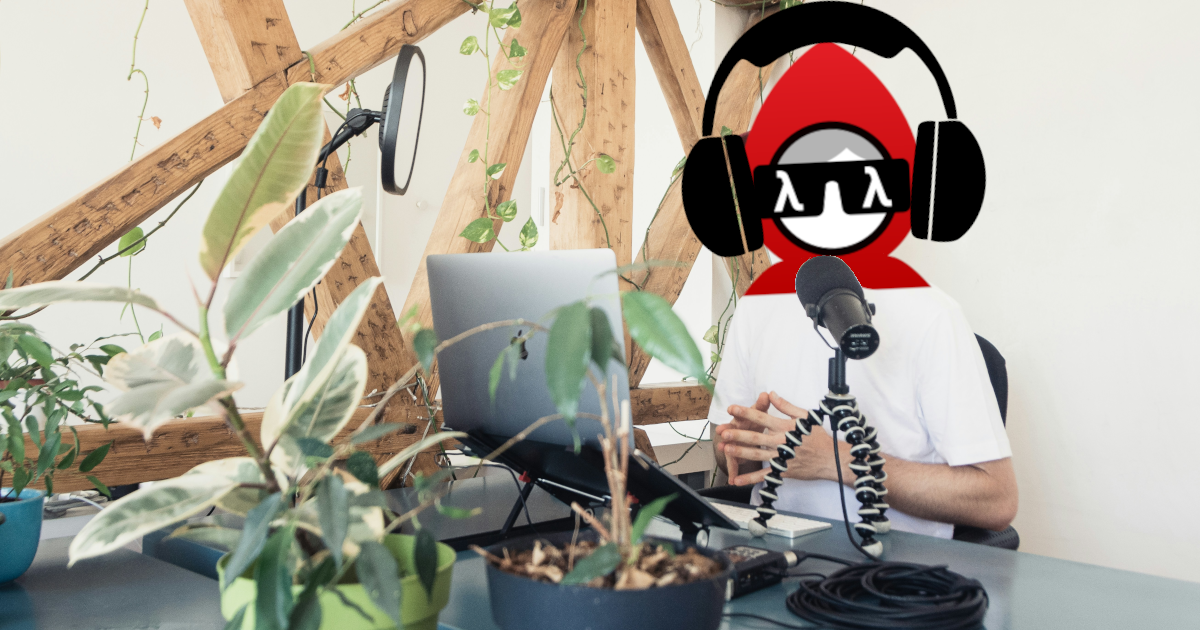 A man with the Babashka logo for a face sits in front of a laptop and a mic