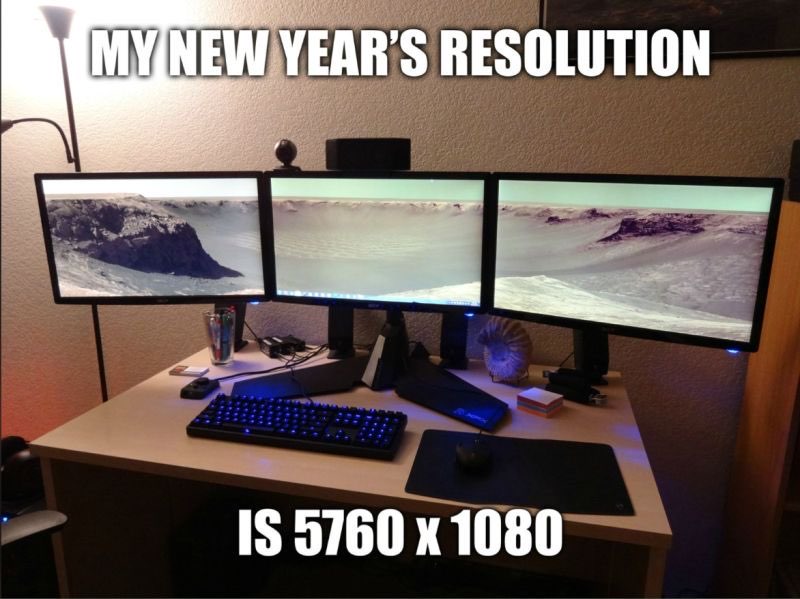 Now that's a wide load! A picture of a three-monitor computer display labelled "My New Year's resolution is 5760x1080"