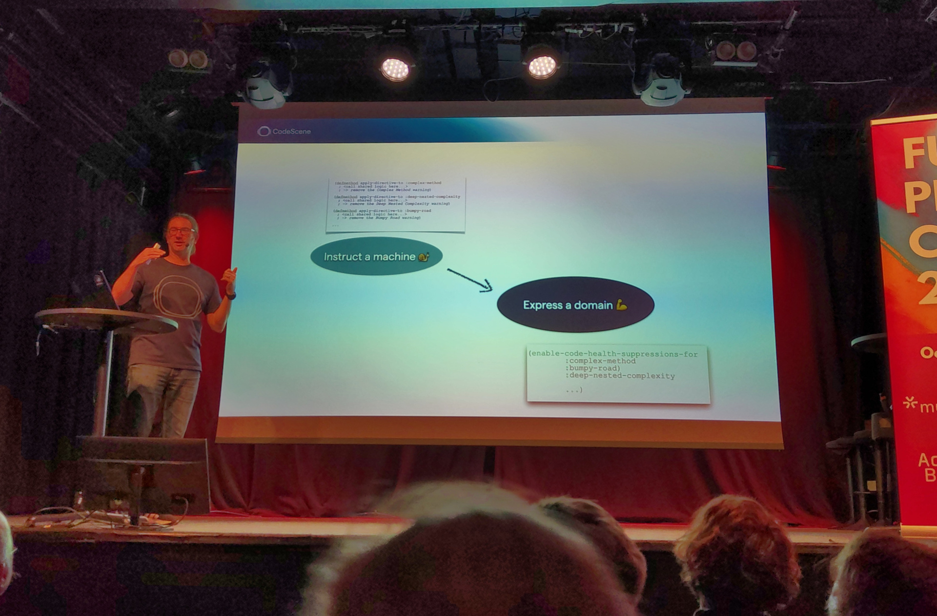 Expressiveness wins again! Adam presents a slide showing a diagram of moving from instructing a machine to expressing a domain
